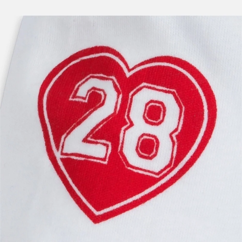 White Long Sleeve Baby Onesie with Red and Blue Accents